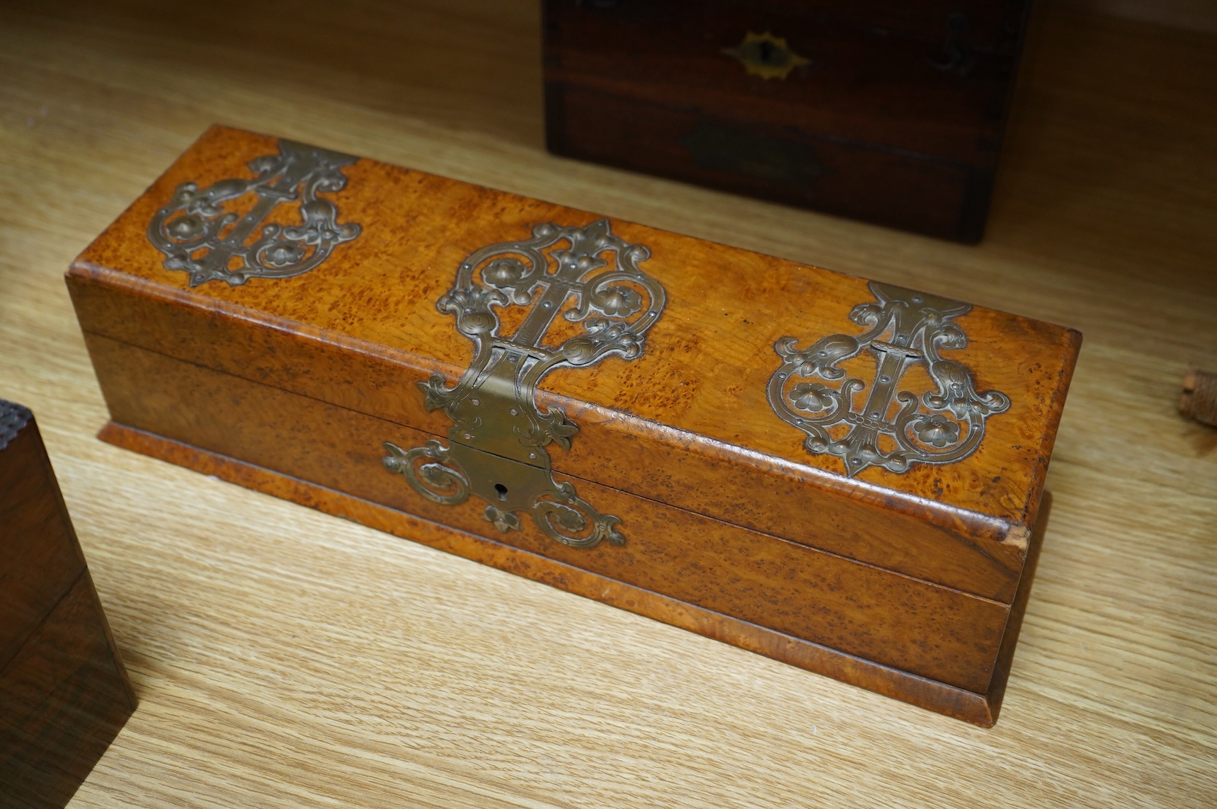 Four boxes to include a burr elm bound example, together with a French inlaid ‘Thé’ caddy with porcelain canisters, largest 32cm wide